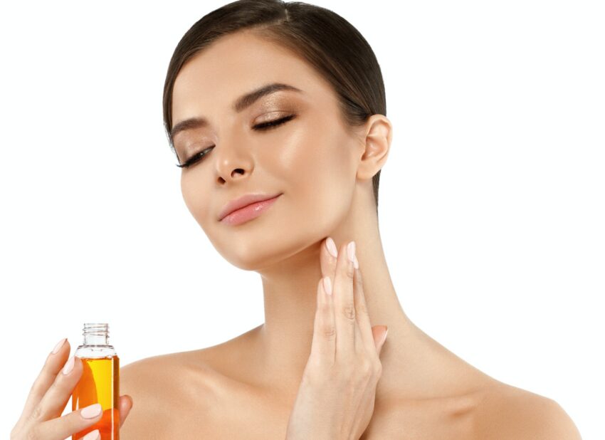 Woman with oil cosmetic beauty skin care concept. Young female model spa with oil skincare