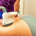 Woman gets anti-cellulite and anti-fat therapy in beauty salon