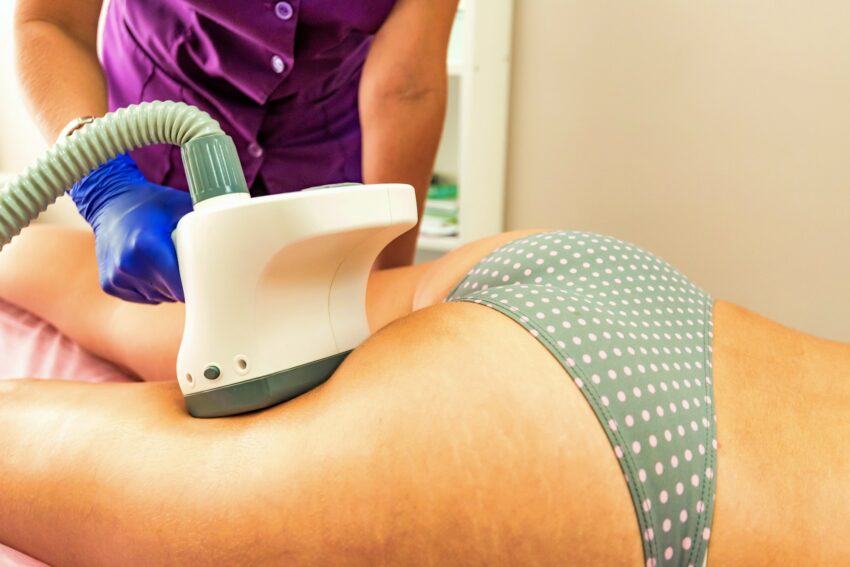 Woman gets anti-cellulite and anti-fat therapy in beauty salon
